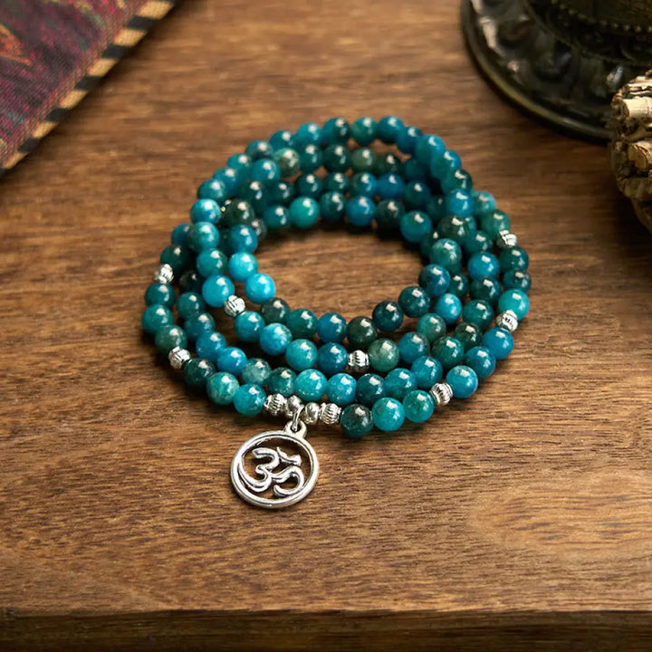 BWOOOH Apatite 108 Mala Beads bracelet with an intricate Om, Tree of Life, or Lotus pendant. This 6mm natural apatite bead mala is designed for meditation, spiritual clarity, and balancing inner energy.