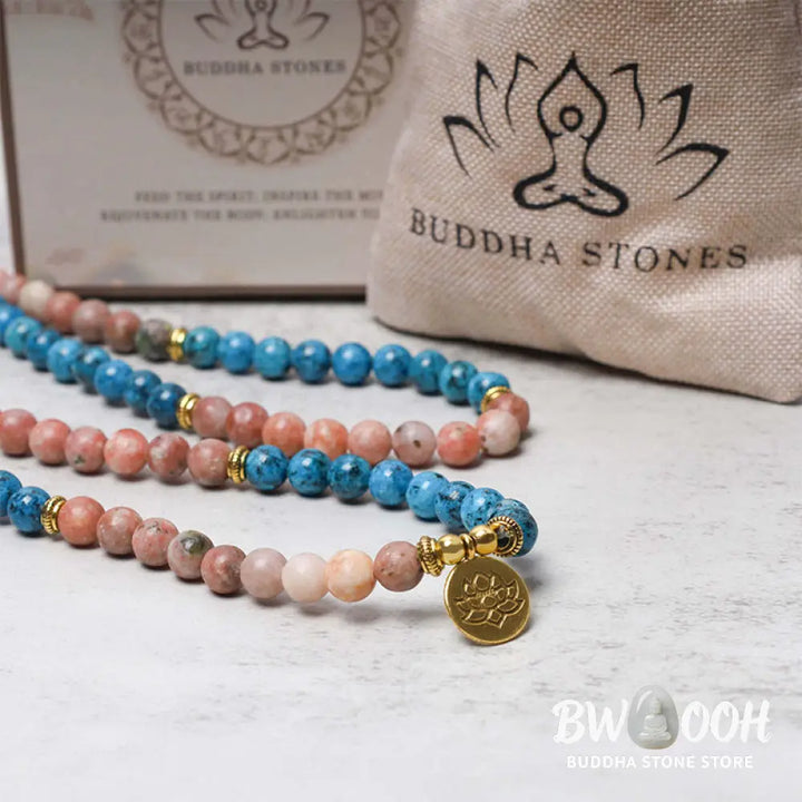 A close-up of the BWOOOH 108 Mala Beads Apatite Red Stone Lotus Meditation Prayer Bead Bracelet, showcasing the vibrant 8mm Apatite and Red Stone beads, intricate Lotus symbol, and premium elastic string, ready for mindfulness practice. - View 4