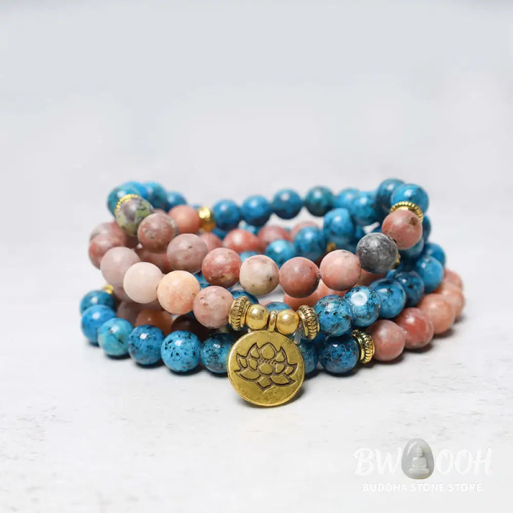 A close-up of the BWOOOH 108 Mala Beads Apatite Red Stone Lotus Meditation Prayer Bead Bracelet, showcasing the vibrant 8mm Apatite and Red Stone beads, intricate Lotus symbol, and premium elastic string, ready for mindfulness practice. - View 2