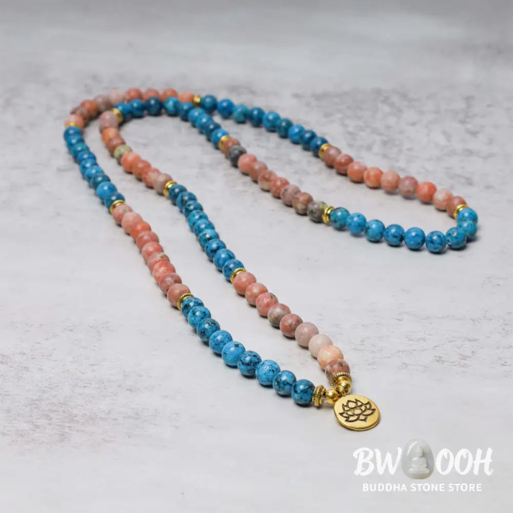 A close-up of the BWOOOH 108 Mala Beads Apatite Red Stone Lotus Meditation Prayer Bead Bracelet, showcasing the vibrant 8mm Apatite and Red Stone beads, intricate Lotus symbol, and premium elastic string, ready for mindfulness practice. - View 3