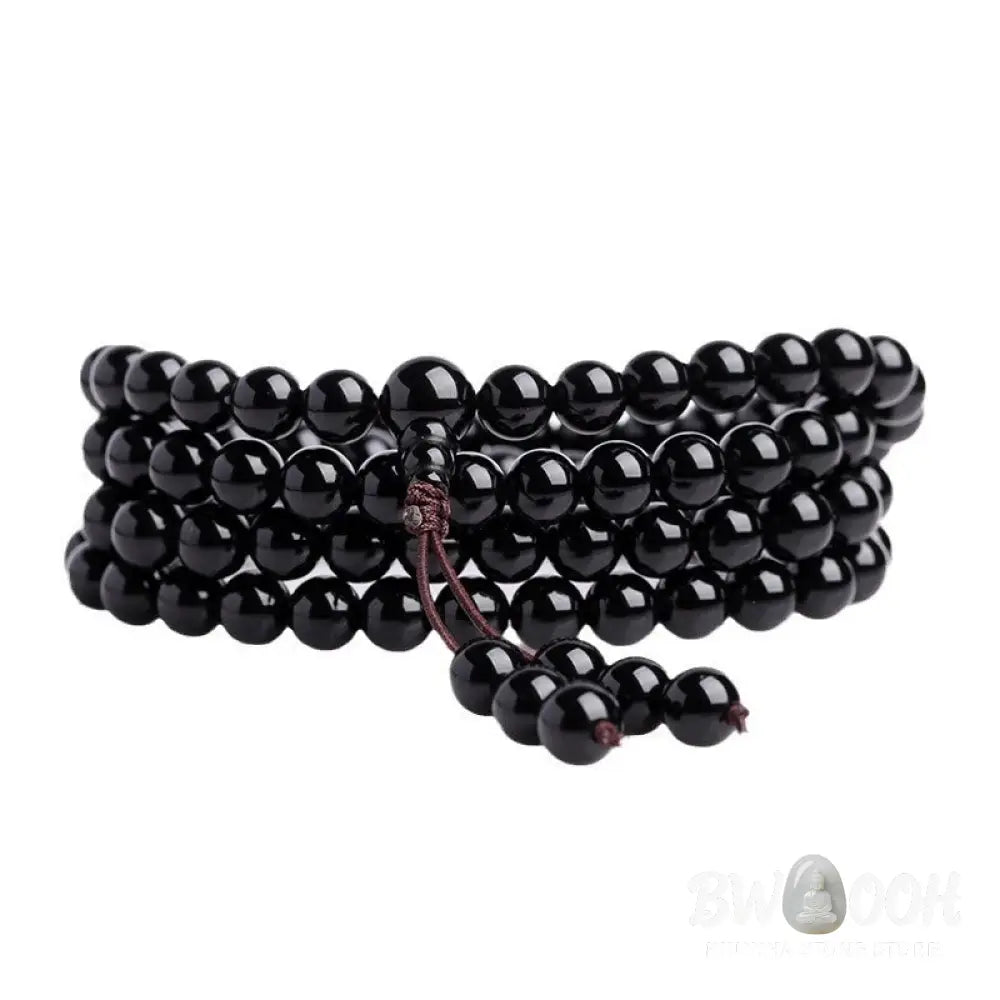 BWOOOH 108 Mala Beads crafted from polished Black Obsidian and shimmering Ice Obsidian, symbolizing energy protection and inner fulfillment, designed for meditation and mindfulness, photographed on a serene, textured surface. - View 9