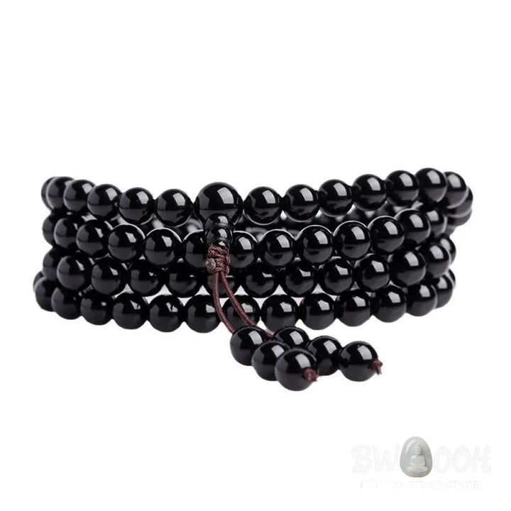 BWOOOH 108 Mala Beads crafted from polished Black Obsidian and shimmering Ice Obsidian, symbolizing energy protection and inner fulfillment, designed for meditation and mindfulness, photographed on a serene, textured surface. - View 9