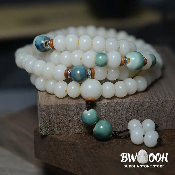 Close-up of BWOOOH 108 Bodhi Seed Mala beads, dark-speckled, strung on premium elastic, symbolizing wisdom, protection, and deep calm for meditation. - View 10