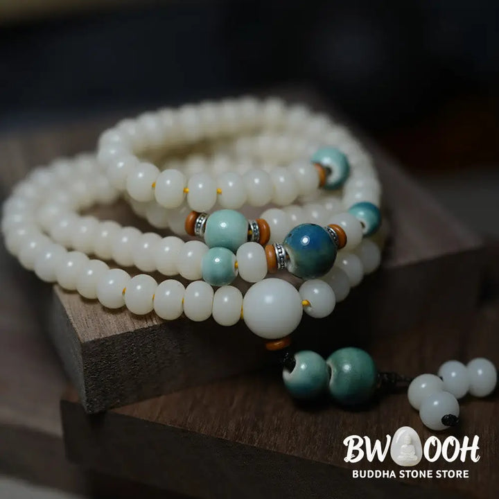 Close-up of BWOOOH 108 Bodhi Seed Mala beads, dark-speckled, strung on premium elastic, symbolizing wisdom, protection, and deep calm for meditation. - View 8