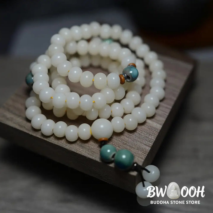 Close-up of BWOOOH 108 Bodhi Seed Mala beads, dark-speckled, strung on premium elastic, symbolizing wisdom, protection, and deep calm for meditation. - View 2