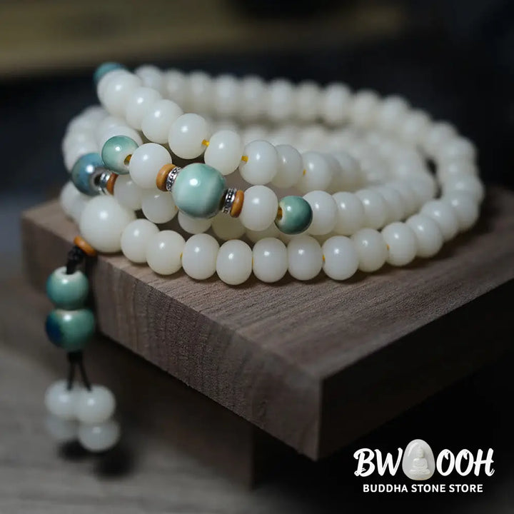Close-up of BWOOOH 108 Bodhi Seed Mala beads, dark-speckled, strung on premium elastic, symbolizing wisdom, protection, and deep calm for meditation. - View 4