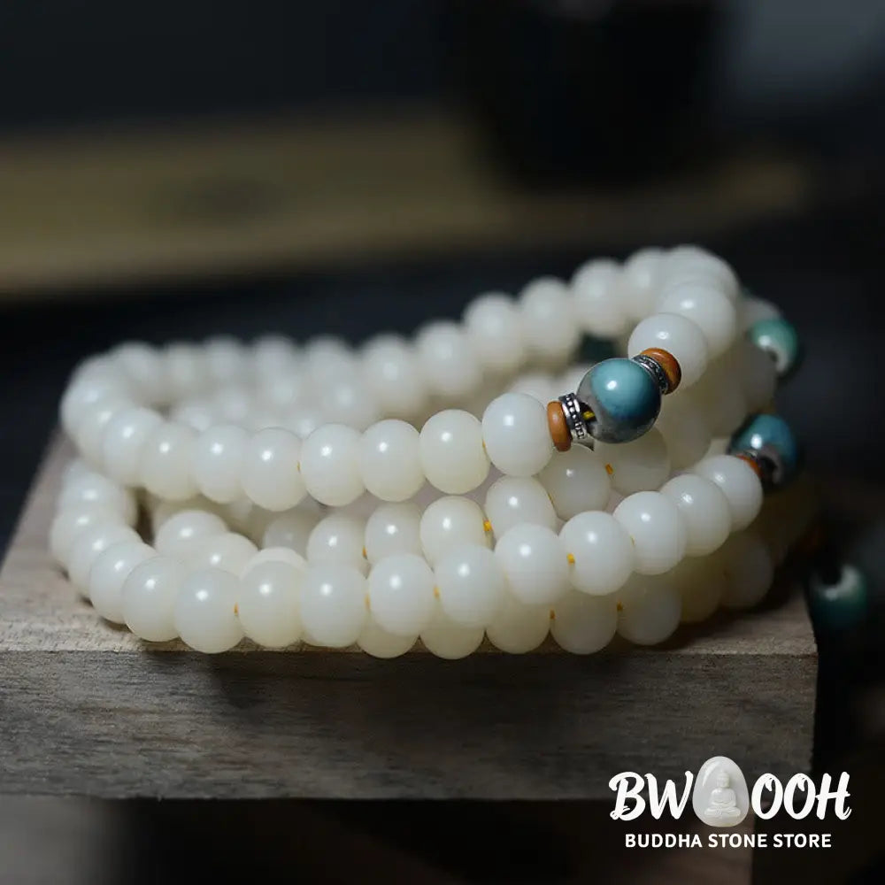 Close-up of BWOOOH 108 Bodhi Seed Mala beads, dark-speckled, strung on premium elastic, symbolizing wisdom, protection, and deep calm for meditation. - View 9