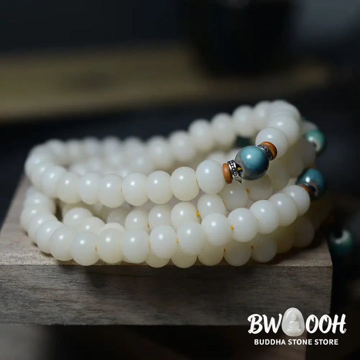 Close-up of BWOOOH 108 Bodhi Seed Mala beads, dark-speckled, strung on premium elastic, symbolizing wisdom, protection, and deep calm for meditation. - View 9