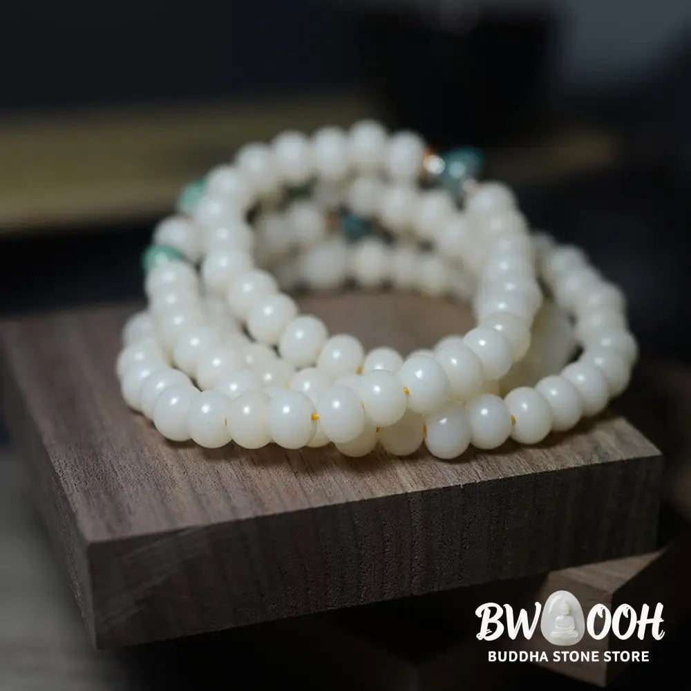 Close-up of BWOOOH 108 Bodhi Seed Mala beads, dark-speckled, strung on premium elastic, symbolizing wisdom, protection, and deep calm for meditation. - View 3