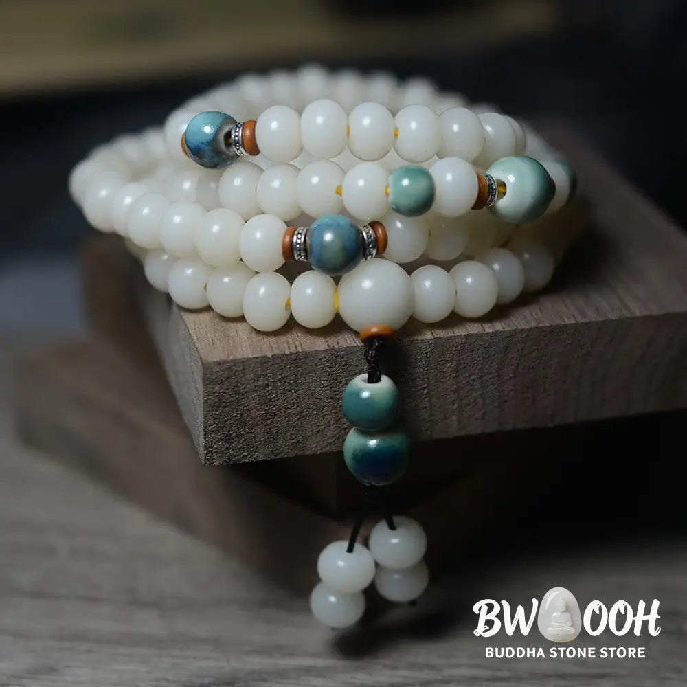 Close-up of BWOOOH 108 Bodhi Seed Mala beads, dark-speckled, strung on premium elastic, symbolizing wisdom, protection, and deep calm for meditation. - View 5