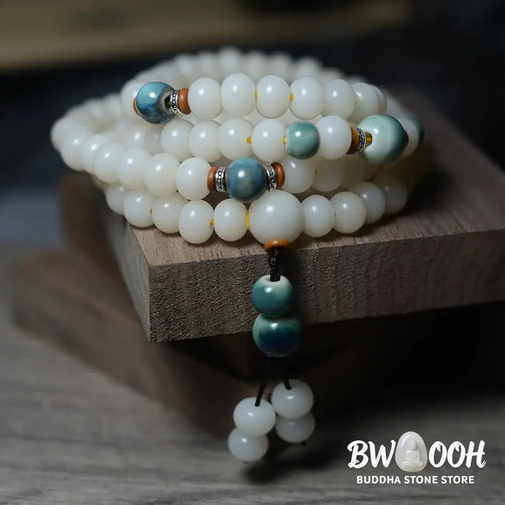 Close-up of BWOOOH 108 Bodhi Seed Mala beads, dark-speckled, strung on premium elastic, symbolizing wisdom, protection, and deep calm for meditation. - View 5