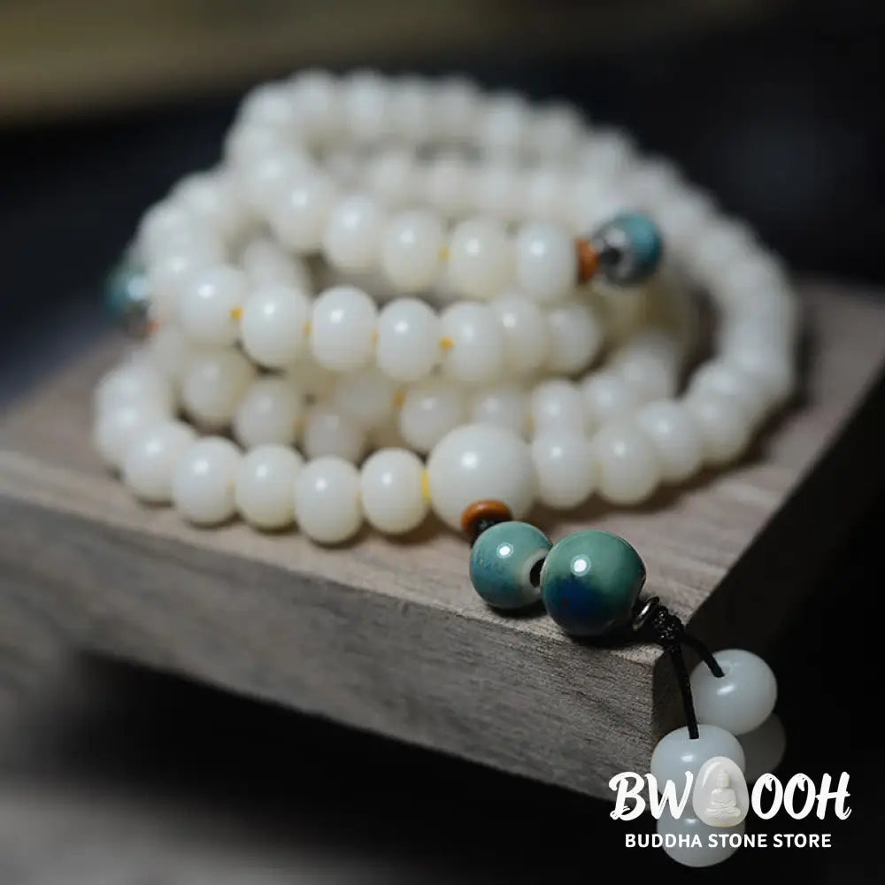 Close-up of BWOOOH 108 Bodhi Seed Mala beads, dark-speckled, strung on premium elastic, symbolizing wisdom, protection, and deep calm for meditation. - View 7
