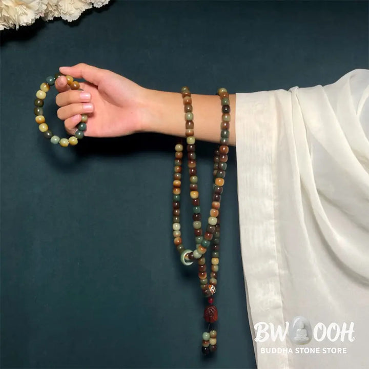 BWOOOH 108-bead Bodhi Seed Peace Wisdom Mala bracelet, showcasing dark-speckled bodhi seeds and small leaf red sandalwood accents, designed as a wrist or pocket mala for meditation and spiritual enlightenment. - View 3
