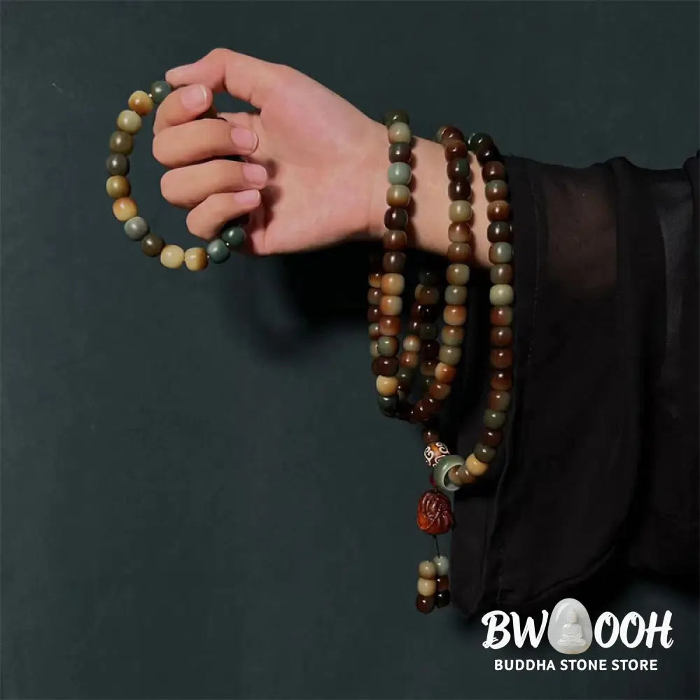 BWOOOH 108-bead Bodhi Seed Peace Wisdom Mala bracelet, showcasing dark-speckled bodhi seeds and small leaf red sandalwood accents, designed as a wrist or pocket mala for meditation and spiritual enlightenment. - View 2