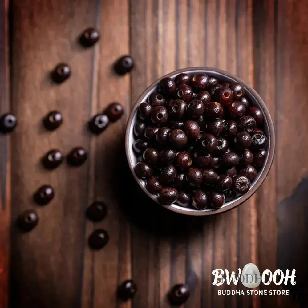 A close-up of the BWOOOH 108 Mala Bracelet, showcasing polished red Bowl Bodhi seeds, each with a distinct &
