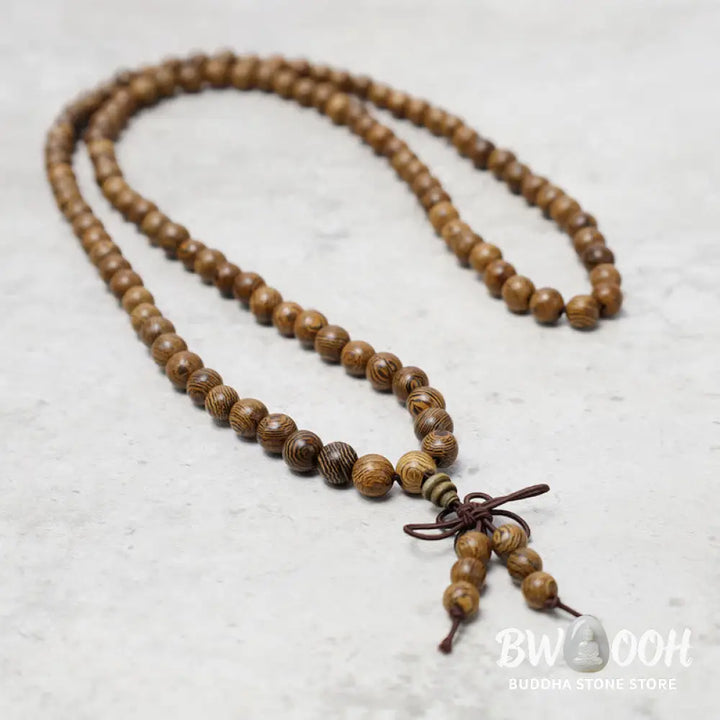 A close-up of the BWOOOH 108 mala beads bracelet, showcasing smooth, aromatic sandalwood interspersed with dark ebony, rich rosewood, and stabilizing wenge wood. The elastic design highlights the natural wood grain, perfect for meditation, prayer, and achieving daily spiritual balance. - View 18