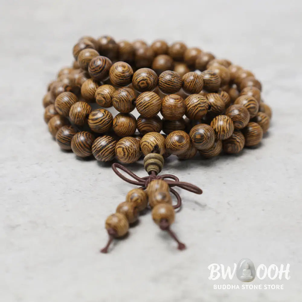 A close-up of the BWOOOH 108 mala beads bracelet, showcasing smooth, aromatic sandalwood interspersed with dark ebony, rich rosewood, and stabilizing wenge wood. The elastic design highlights the natural wood grain, perfect for meditation, prayer, and achieving daily spiritual balance. - View 17