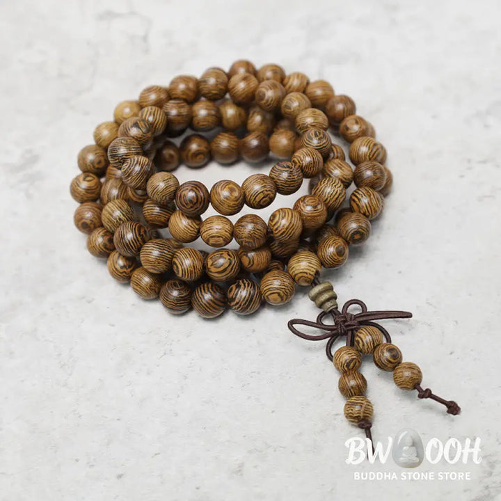 A close-up of the BWOOOH 108 mala beads bracelet, showcasing smooth, aromatic sandalwood interspersed with dark ebony, rich rosewood, and stabilizing wenge wood. The elastic design highlights the natural wood grain, perfect for meditation, prayer, and achieving daily spiritual balance. - View 15