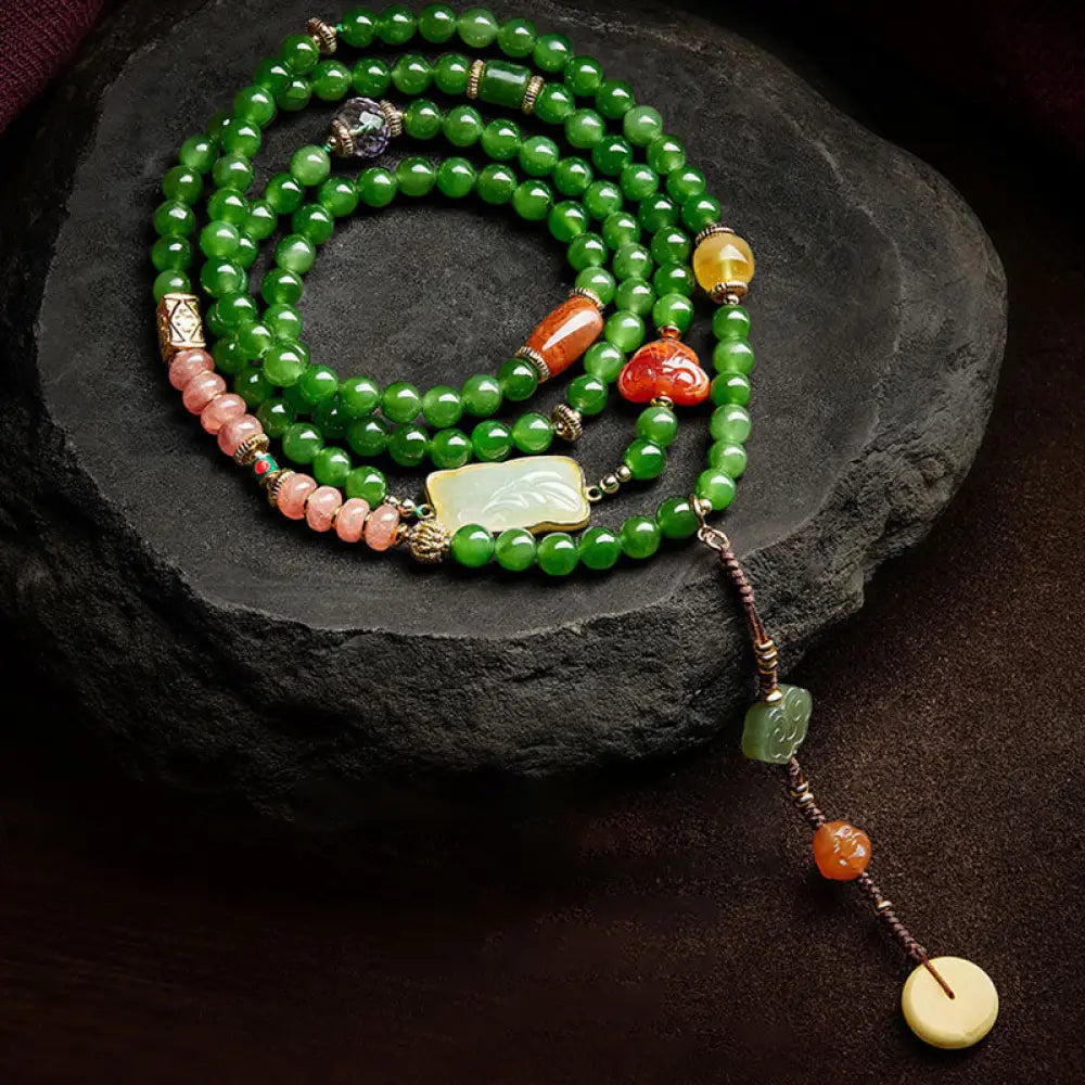 BWOOOH 108-bead meditation mala: vibrant Cyan Jade, rich Red Agate Laughing Buddha, Hetian Jade Ruyi 'Wish Lock,' and serene Amber 'Peace Buckle' for mindfulness.