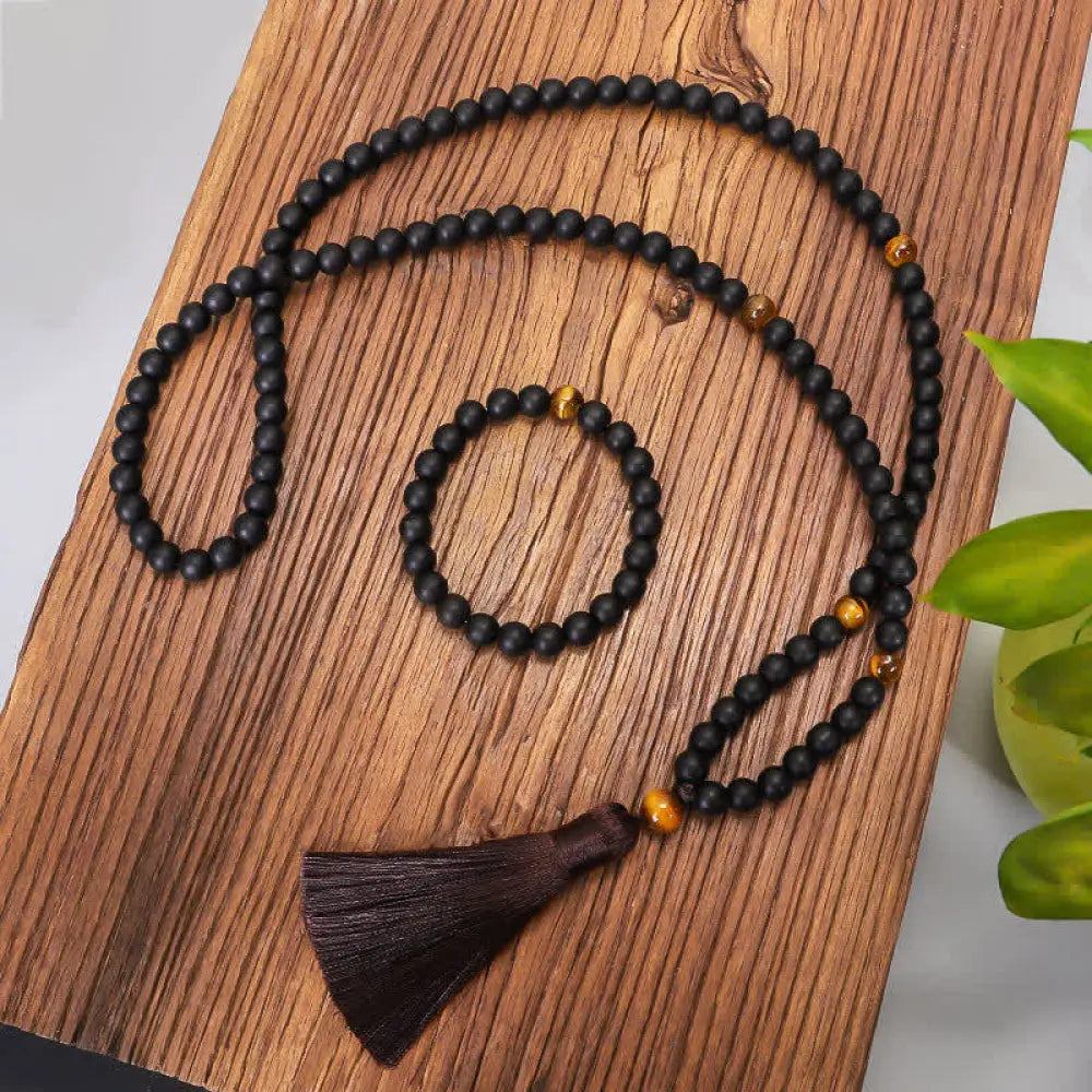 BWOOOH 108 Mala beads featuring frosted stone and natural tiger eye, worn as a balance bracelet and spiritual necklace pendant on elastic string.