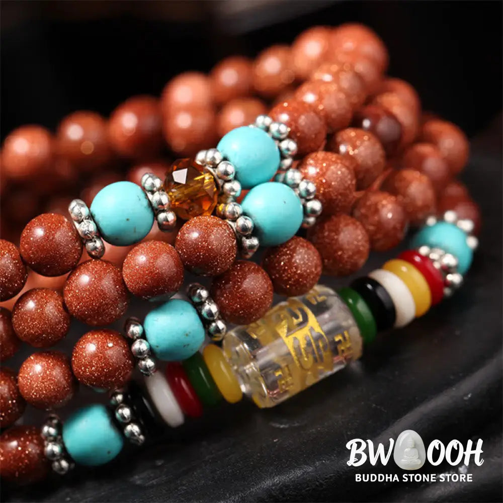 BWOOOH 108 Goldstone Mala Confidence Bracelet with Om Mani Padme Hum and Swastika symbols, promoting spiritual focus, balance, and positive energy during meditation. - View 4