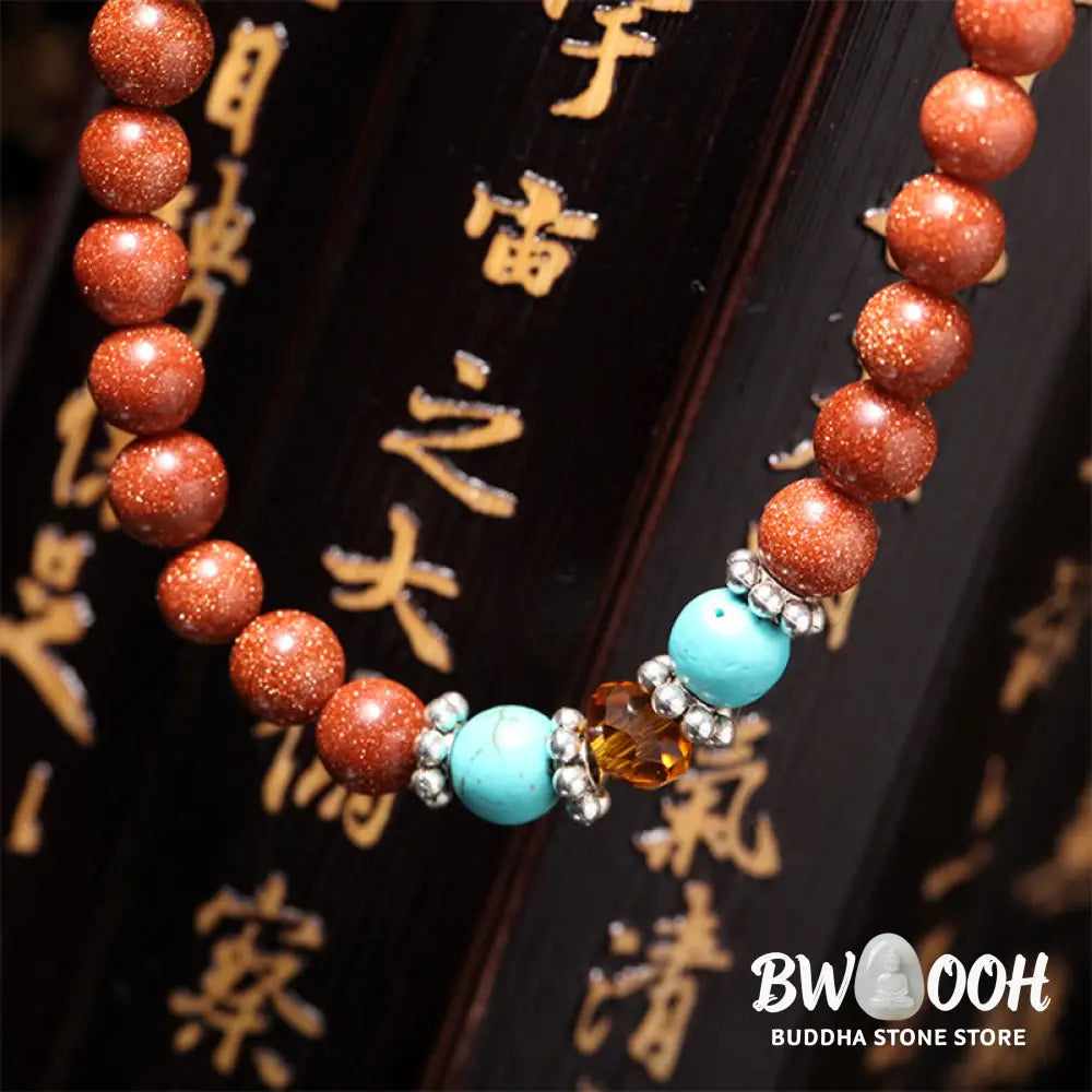 BWOOOH 108 Goldstone Mala Confidence Bracelet with Om Mani Padme Hum and Swastika symbols, promoting spiritual focus, balance, and positive energy during meditation. - View 5