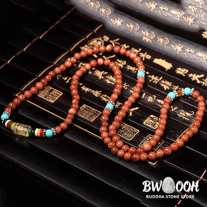 BWOOOH 108 Goldstone Mala Confidence Bracelet with Om Mani Padme Hum and Swastika symbols, promoting spiritual focus, balance, and positive energy during meditation. - View 8