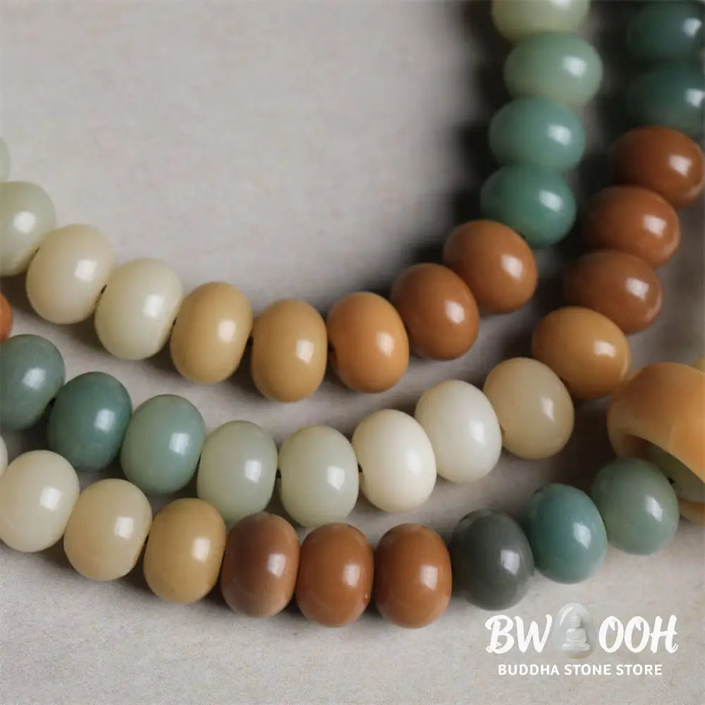 Close-up of BWOOOH 108 gradient Bodhi Seed mala beads, each hand-engraved with a subtle Buddha hand symbol, strung on an elastic peace bracelet, showcasing unique dark-speckled textures. - View 5