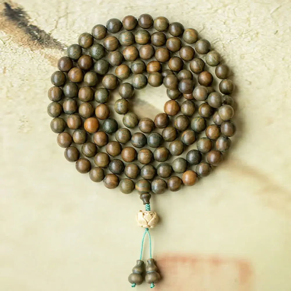 BWOOOH 108 mala beads bracelet crafted from natural green sandalwood and boxwood, featuring a distinct lotus symbol charm, designed for meditation, positive energy, and spiritual tranquility. - View 11
