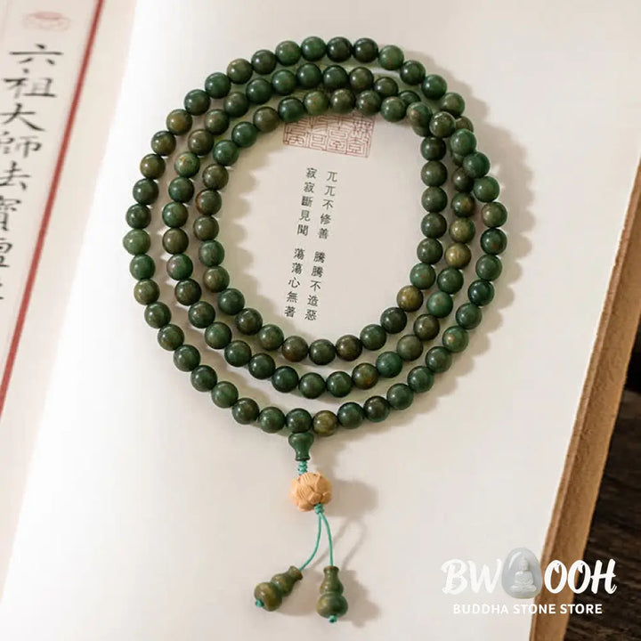 BWOOOH 108 mala beads bracelet crafted from natural green sandalwood and boxwood, featuring a distinct lotus symbol charm, designed for meditation, positive energy, and spiritual tranquility. - View 12