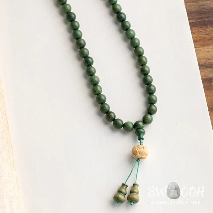 BWOOOH 108 mala beads bracelet crafted from natural green sandalwood and boxwood, featuring a distinct lotus symbol charm, designed for meditation, positive energy, and spiritual tranquility. - View 19