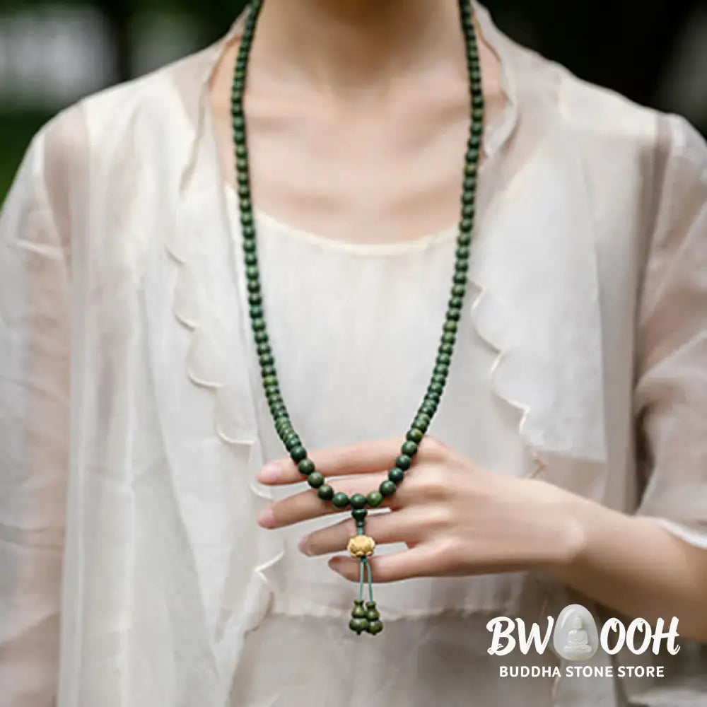BWOOOH 108 mala beads bracelet crafted from natural green sandalwood and boxwood, featuring a distinct lotus symbol charm, designed for meditation, positive energy, and spiritual tranquility. - View 4