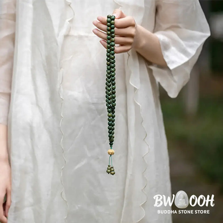 BWOOOH 108 mala beads bracelet crafted from natural green sandalwood and boxwood, featuring a distinct lotus symbol charm, designed for meditation, positive energy, and spiritual tranquility. - View 13