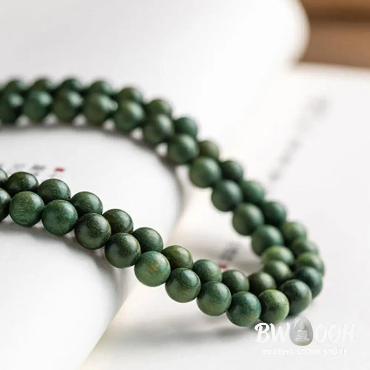 BWOOOH 108 mala beads bracelet crafted from natural green sandalwood and boxwood, featuring a distinct lotus symbol charm, designed for meditation, positive energy, and spiritual tranquility. - View 16