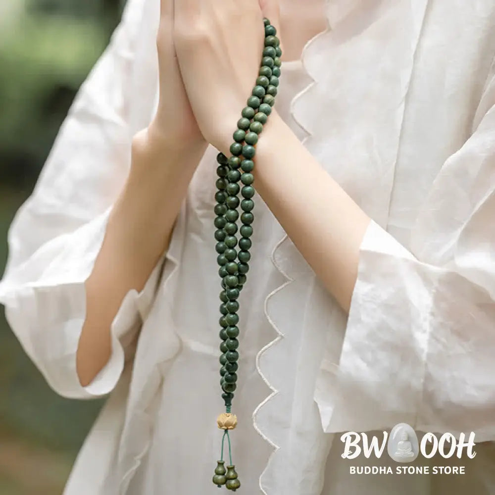 BWOOOH 108 mala beads bracelet crafted from natural green sandalwood and boxwood, featuring a distinct lotus symbol charm, designed for meditation, positive energy, and spiritual tranquility. - View 3