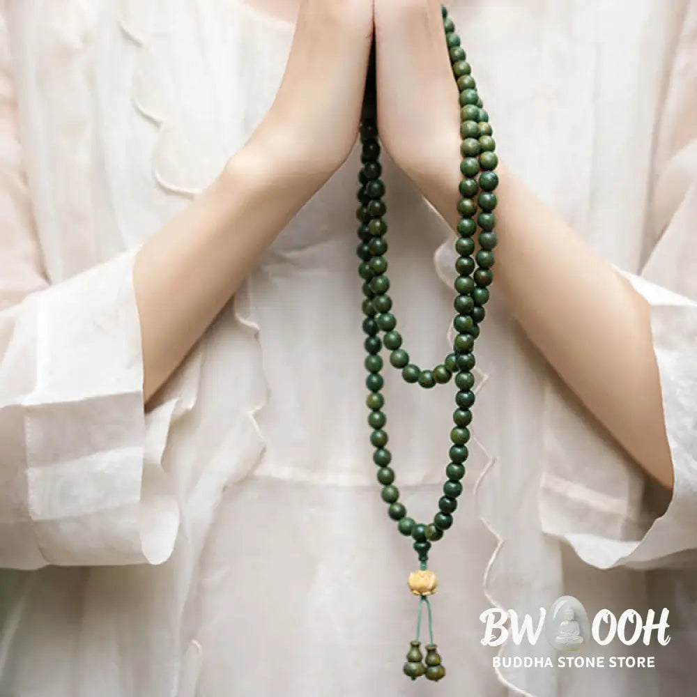 BWOOOH 108 mala beads bracelet crafted from natural green sandalwood and boxwood, featuring a distinct lotus symbol charm, designed for meditation, positive energy, and spiritual tranquility. - View 7