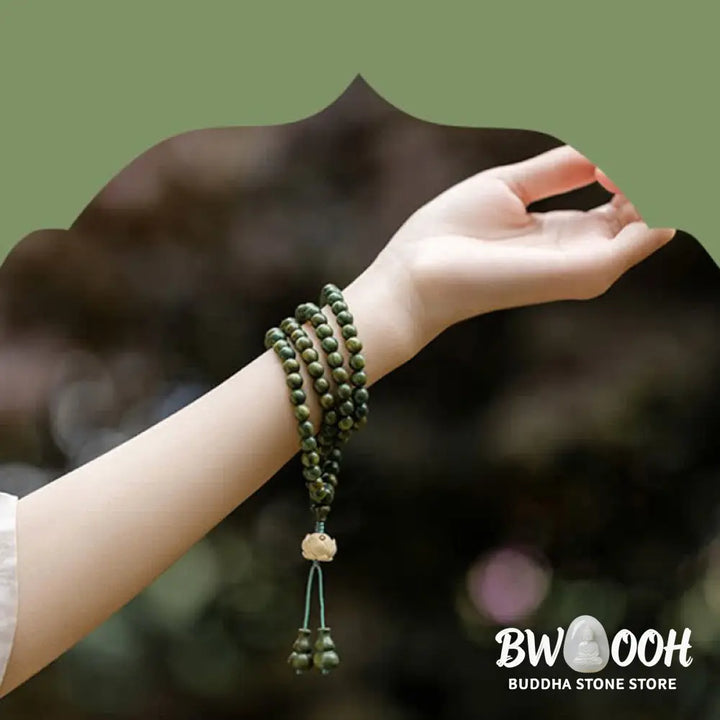 BWOOOH 108 mala beads bracelet crafted from natural green sandalwood and boxwood, featuring a distinct lotus symbol charm, designed for meditation, positive energy, and spiritual tranquility. - View 14