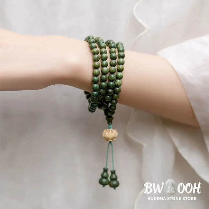 BWOOOH 108 mala beads bracelet crafted from natural green sandalwood and boxwood, featuring a distinct lotus symbol charm, designed for meditation, positive energy, and spiritual tranquility. - View 2