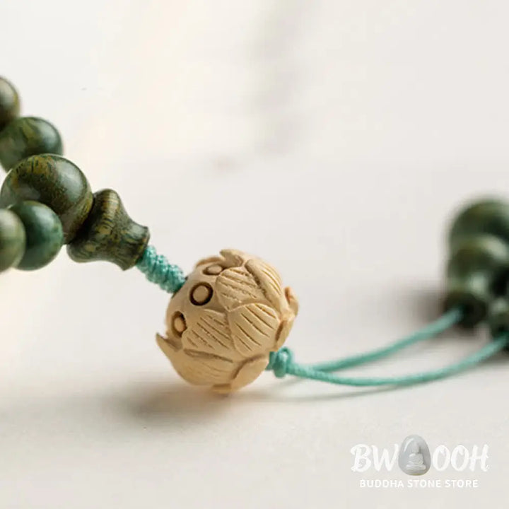 BWOOOH 108 mala beads bracelet crafted from natural green sandalwood and boxwood, featuring a distinct lotus symbol charm, designed for meditation, positive energy, and spiritual tranquility. - View 17