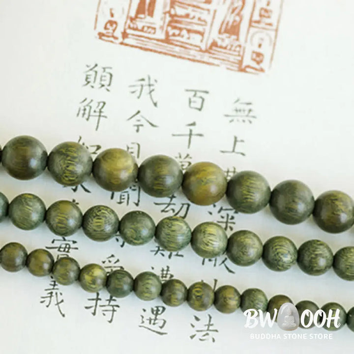BWOOOH 108 mala beads bracelet crafted from natural green sandalwood and boxwood, featuring a distinct lotus symbol charm, designed for meditation, positive energy, and spiritual tranquility. - View 15