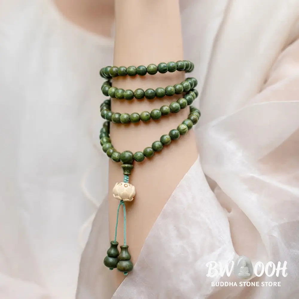 BWOOOH 108 mala beads bracelet crafted from natural green sandalwood and boxwood, featuring a distinct lotus symbol charm, designed for meditation, positive energy, and spiritual tranquility. - View 8