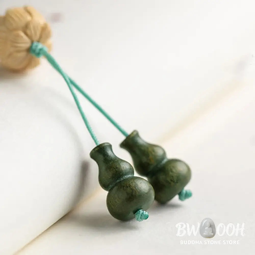 BWOOOH 108 mala beads bracelet crafted from natural green sandalwood and boxwood, featuring a distinct lotus symbol charm, designed for meditation, positive energy, and spiritual tranquility. - View 18