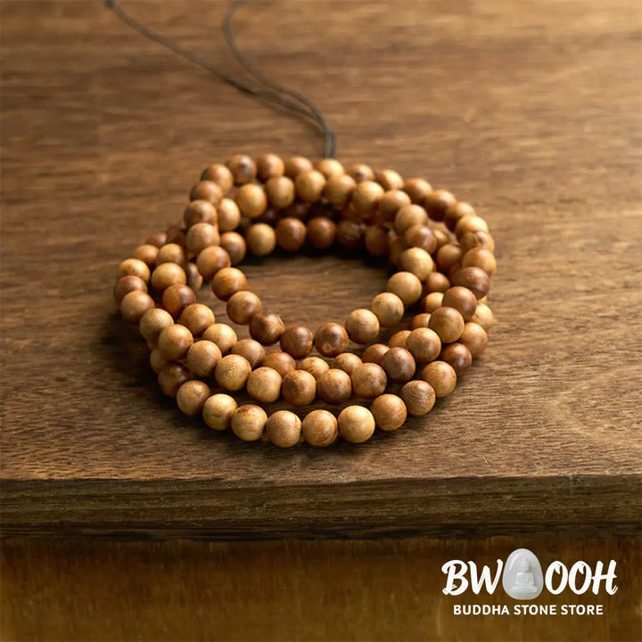 BWOOOH 108 Mala Beads, hand-polished Lightning Strike Peach Wood protection bracelet, 8mm beads on elastic string, worn by a unisex model, symbolizing divine energy and spiritual balance. - View 7