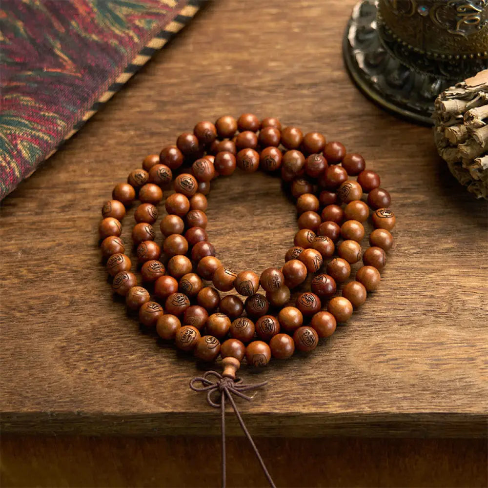 BWOOOH 108 Mala meditation bracelet crafted from authentic lightning-struck jujube wood, featuring individually engraved Golden Light Mantra beads. Unisex design with an elastic string for spiritual protection and mindful practice.