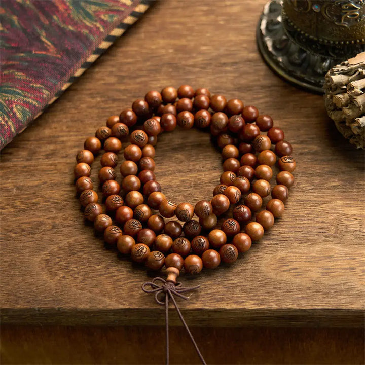 BWOOOH 108 Mala meditation bracelet crafted from authentic lightning-struck jujube wood, featuring individually engraved Golden Light Mantra beads. Unisex design with an elastic string for spiritual protection and mindful practice.