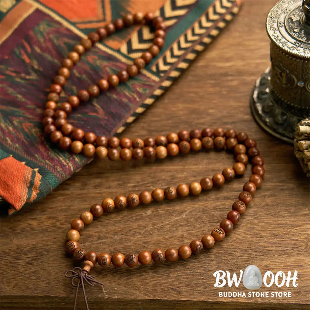 BWOOOH 108 Mala meditation bracelet crafted from authentic lightning-struck jujube wood, featuring individually engraved Golden Light Mantra beads. Unisex design with an elastic string for spiritual protection and mindful practice. - View 5