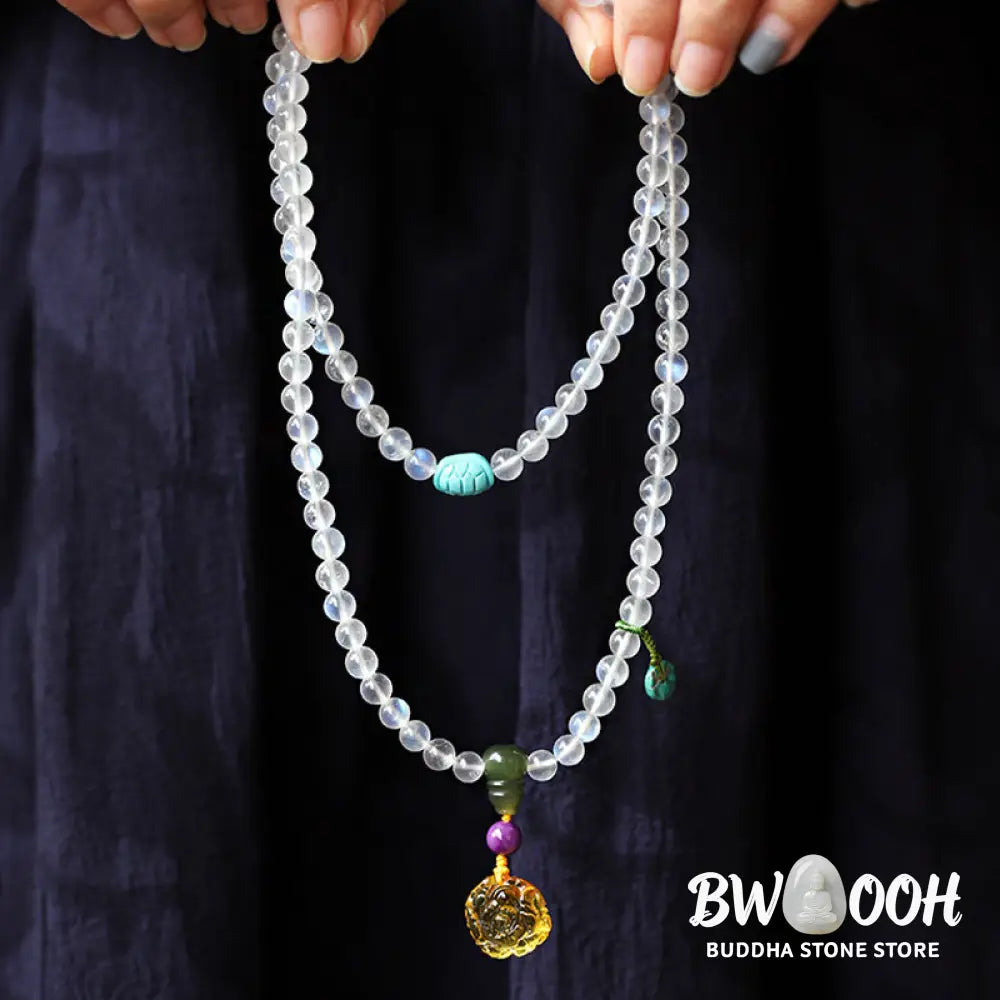 BWOOOH 108 Mala Beads bracelet handcrafted with shimmering Moonstone, warm Amber, vibrant Turquoise, and an engraved Lotus symbol, ideal for meditation and spiritual healing. - View 3