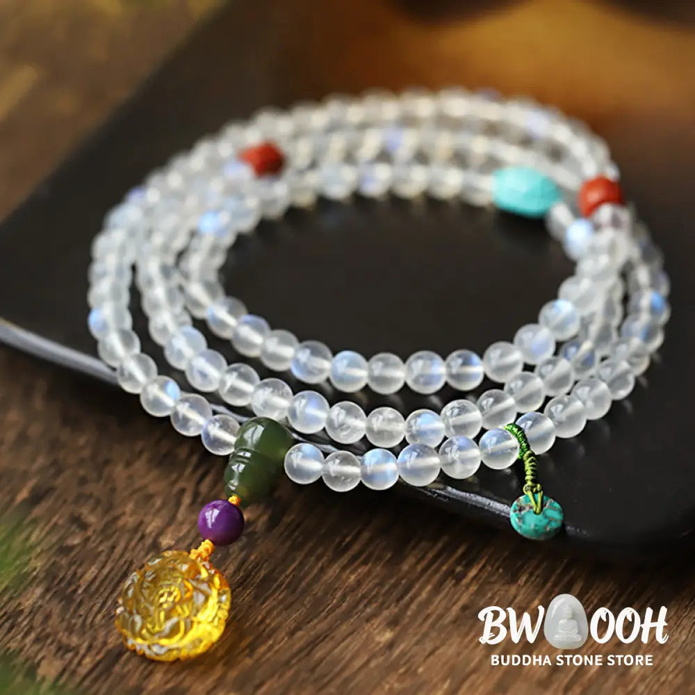 BWOOOH 108 Mala Beads bracelet handcrafted with shimmering Moonstone, warm Amber, vibrant Turquoise, and an engraved Lotus symbol, ideal for meditation and spiritual healing. - View 8