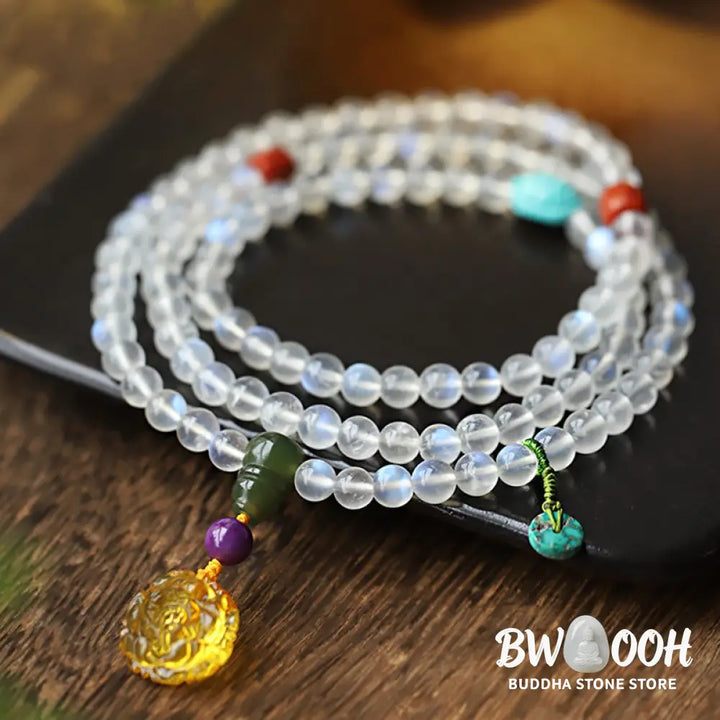 BWOOOH 108 Mala Beads bracelet handcrafted with shimmering Moonstone, warm Amber, vibrant Turquoise, and an engraved Lotus symbol, ideal for meditation and spiritual healing. - View 8
