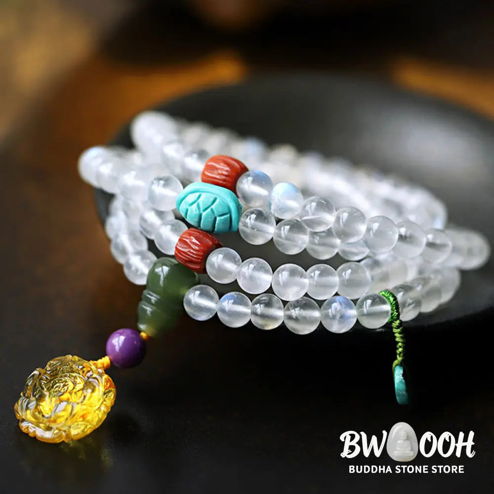 BWOOOH 108 Mala Beads bracelet handcrafted with shimmering Moonstone, warm Amber, vibrant Turquoise, and an engraved Lotus symbol, ideal for meditation and spiritual healing. - View 2